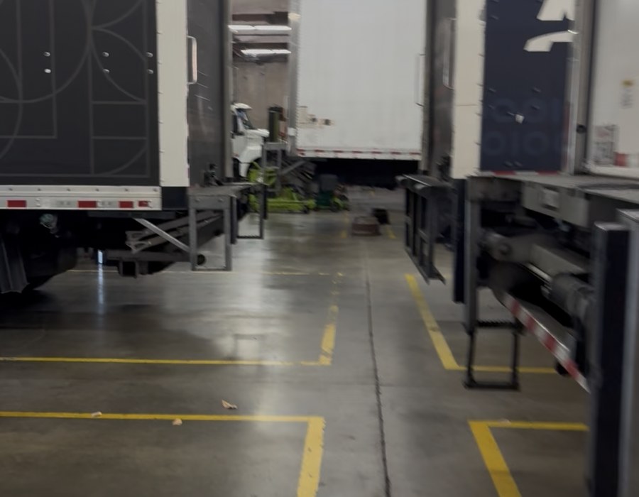 Industrial warehouse cleaned by Green Rose, with painted floor lanes